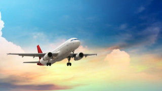 depositphotos47734669-stock-photo-airplane-flying-above-tropical-sea_RAmx4.jpg